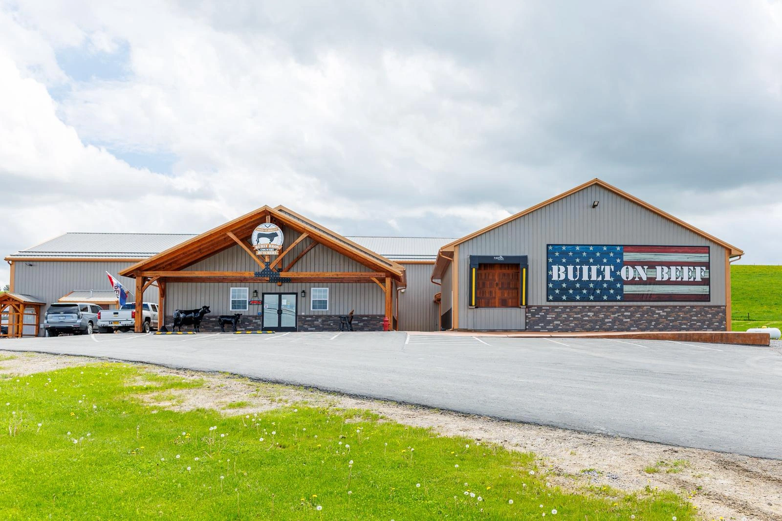Full Burly Brothers Country Butchery building exterior with its timber entrance and Built on Beef mural